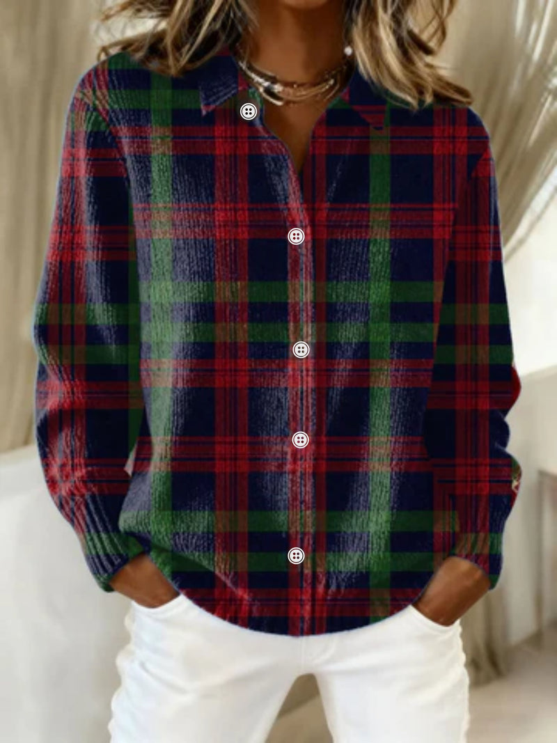 Woman wearing a multicolored checkered blouse with a relaxed, flattering silhouette and crisp lightweight fabric