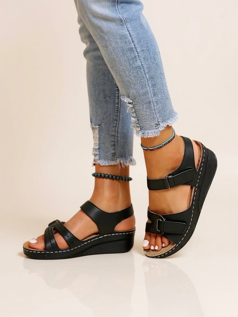 Maren women's cushioned adjustable wedge sandals in black, front three-quarter view