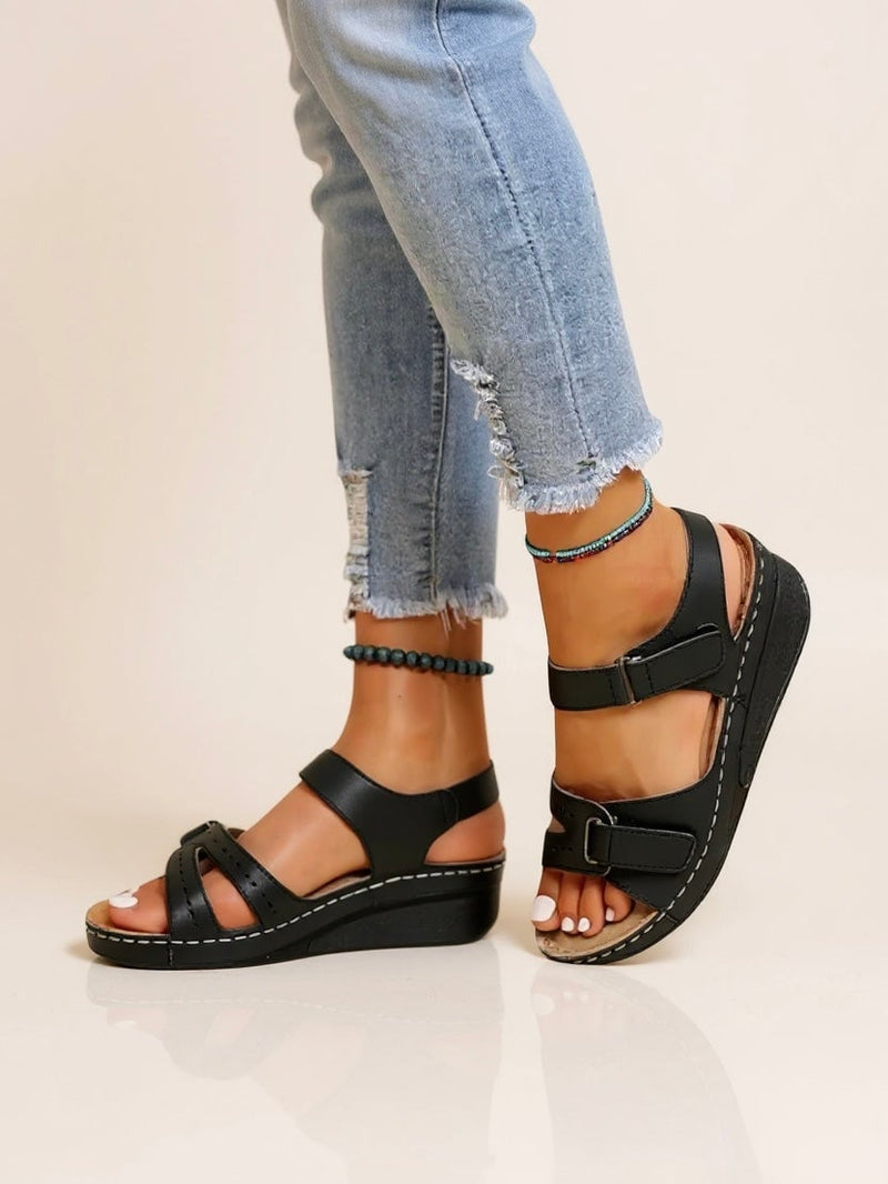 Maren women's cushioned adjustable wedge sandals in black, front three-quarter view