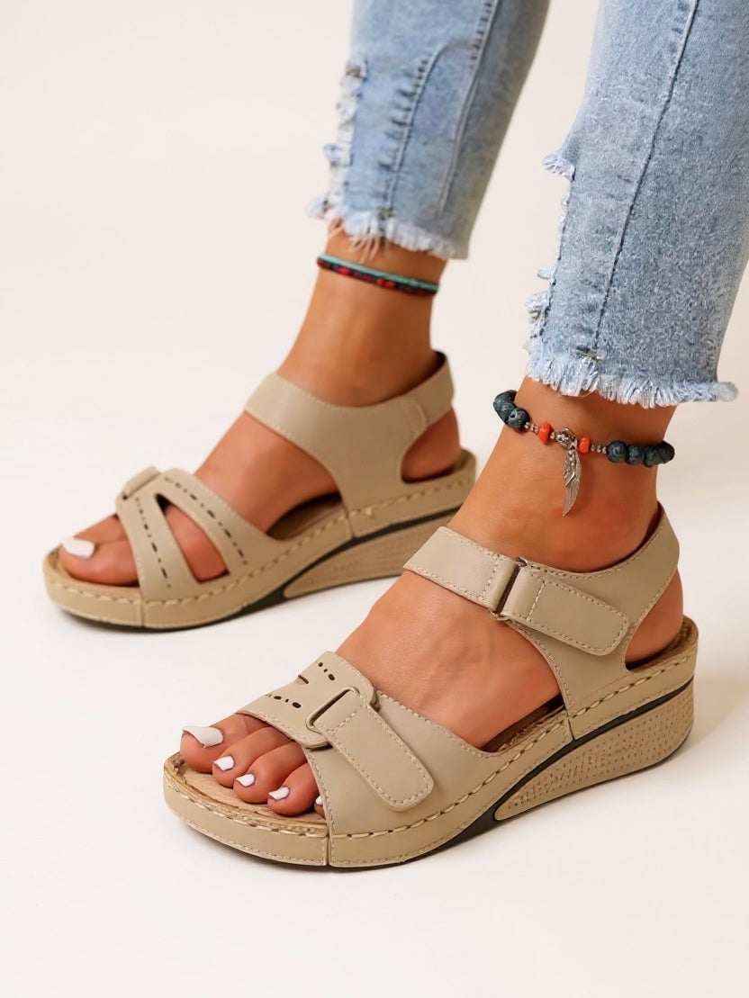Side profile of Maren wedge sandals in beige highlighting wedge heel height