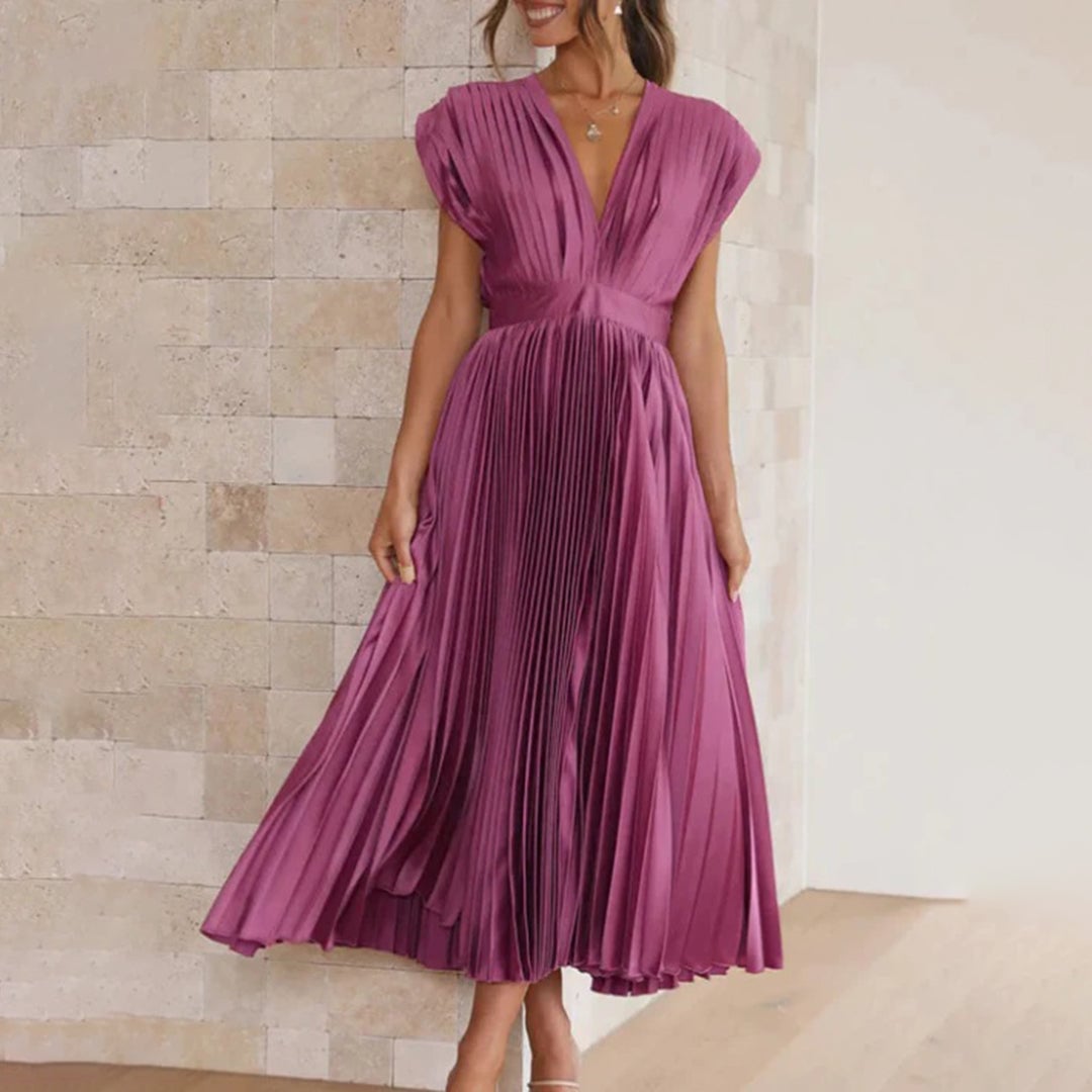 Model wearing the Maren women's wedding guest dress in Champagne, back view
