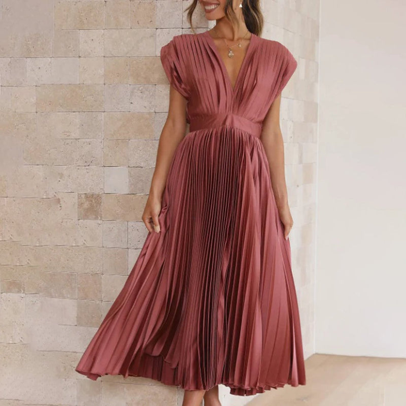 Close-up of the elegant neckline detail on the Maren dress in Champagne