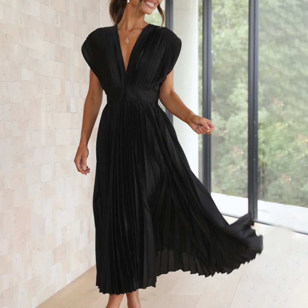 Full-length view of the Maren dress in Plum showing the flowing hem