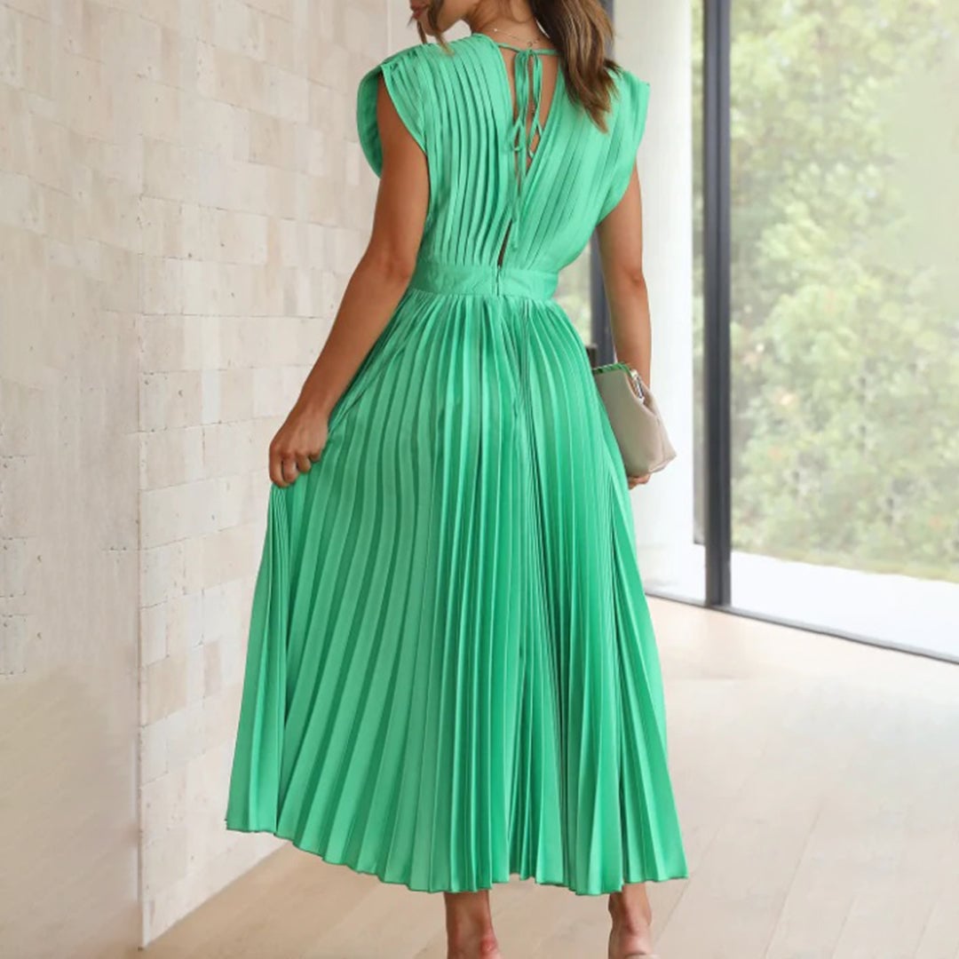 Back view of the Maren dress in Black highlighting the flowing skirt