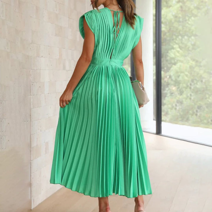Back view of the Maren dress in Black highlighting the flowing skirt