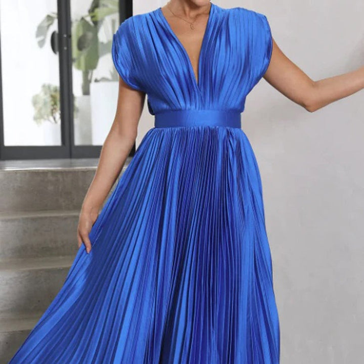 Flat lay of the Maren women's wedding guest dress showing color and fabric