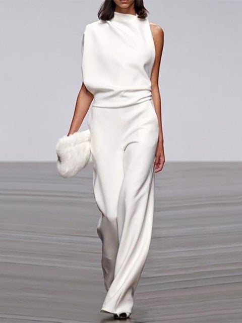 Woman wearing a purple one-shoulder wide-leg jumpsuit, front full-length view