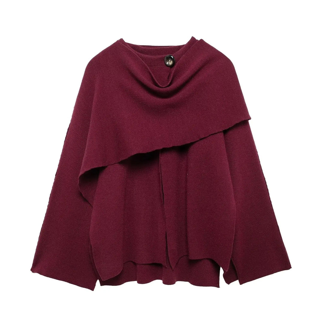 Model styled in the Margaret cape mantel layered over a dress for an elegant evening look