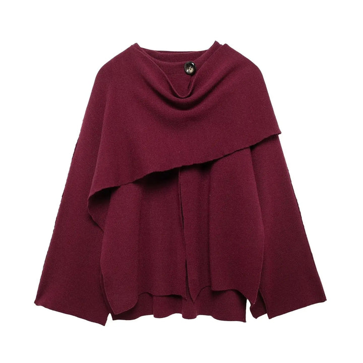 Model styled in the Margaret cape mantel layered over a dress for an elegant evening look