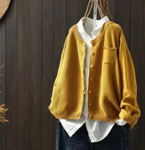 Dark brown relaxed oversized cardigan displayed on a model, showing full-length drape