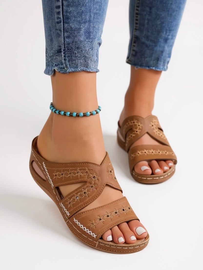 Margaux embroidered slip-on slide sandals in blue with cushioned footbed, front view