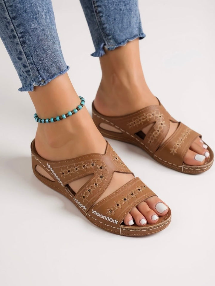 Close-up of intricate embroidery detailing on Margaux women's slide sandals