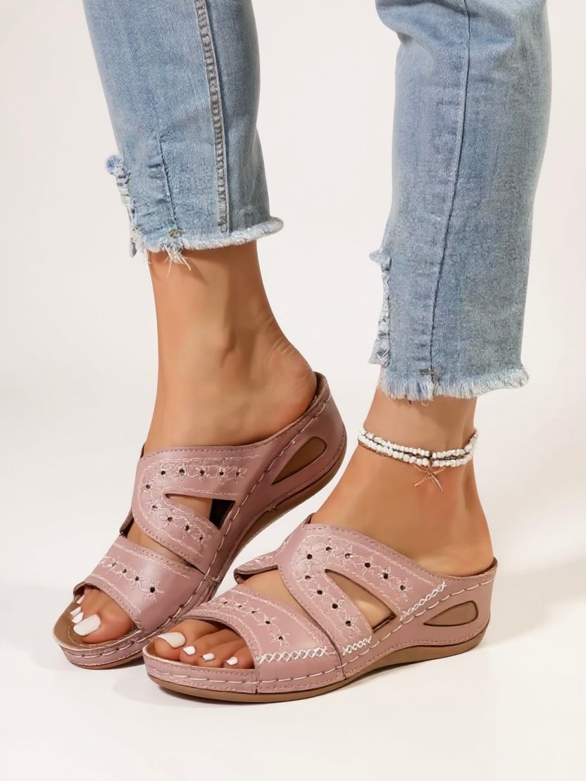 Model wearing Margaux slip-on sandals in blue with a casual summer outfit