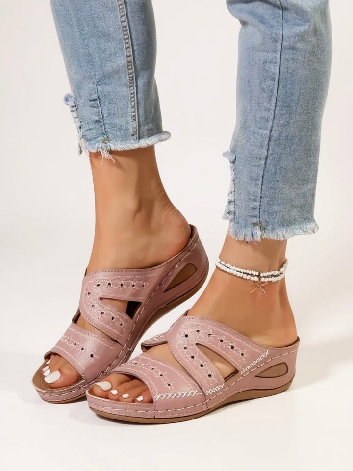 Model wearing Margaux slip-on sandals in blue with a casual summer outfit