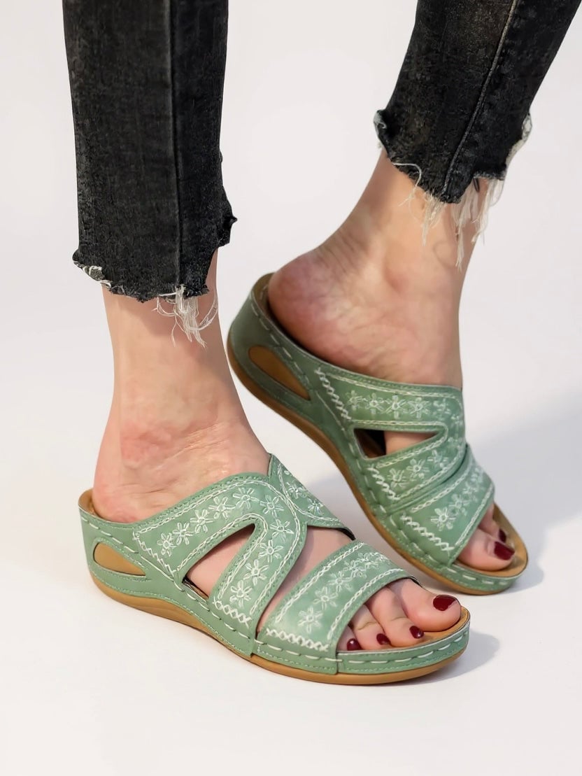 Pair of Margaux cushioned slide sandals in brown arranged heel-to-toe