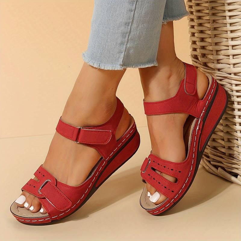 Margaux orthopedic sandals styled with a white summer dress on a woman walking outdoors
