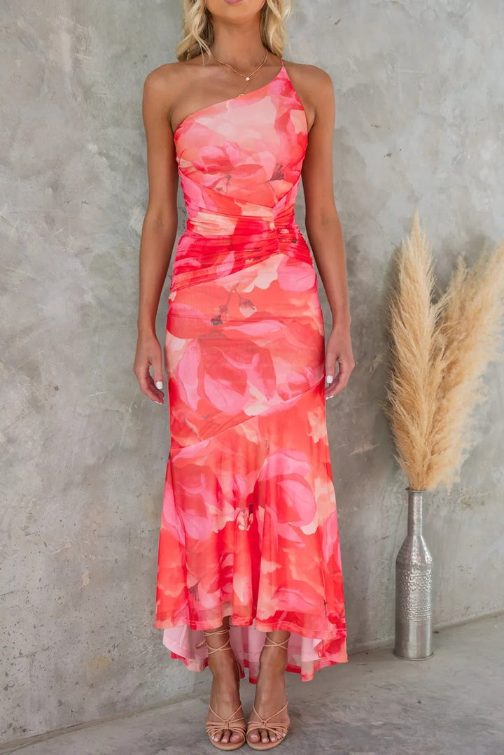 Side view of the Margaux pleated dress in red highlighting the flattering drape and movement