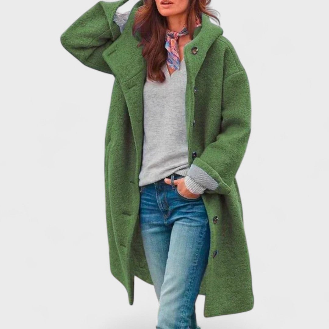 Woman wearing a sleek city jacket in a neutral urban setting, showcasing the flattering fitted silhouette