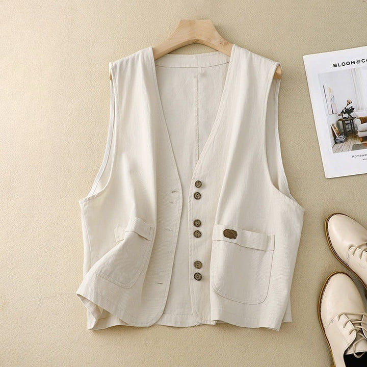 Relaxed button vest with natural-inspired buttons and patch pockets, shown in a neutral colorway