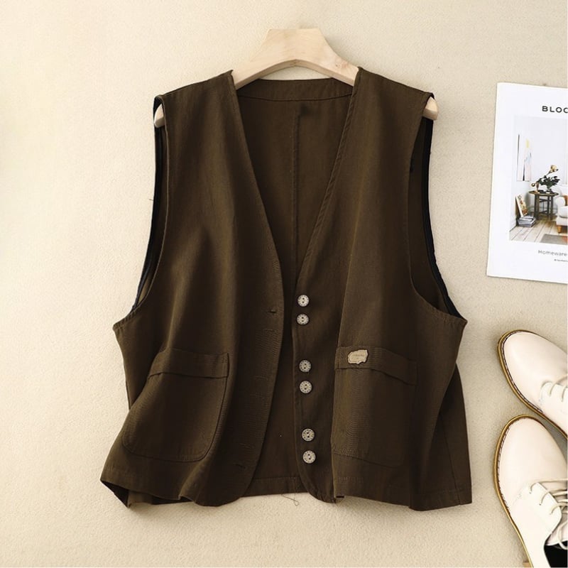 Full-length styling shot of the relaxed button vest layered over a blouse
