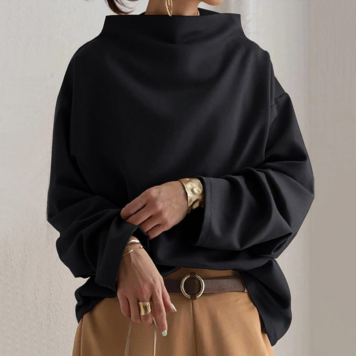 Front view of the Margot high-neck soft knit top in black with a relaxed oversized fit