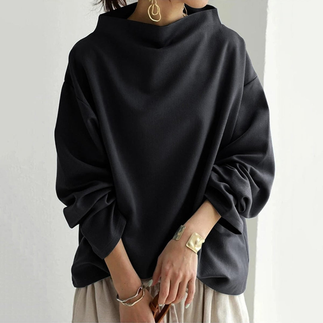 Side view of the Margot soft knit top in white showing the flattering relaxed silhouette