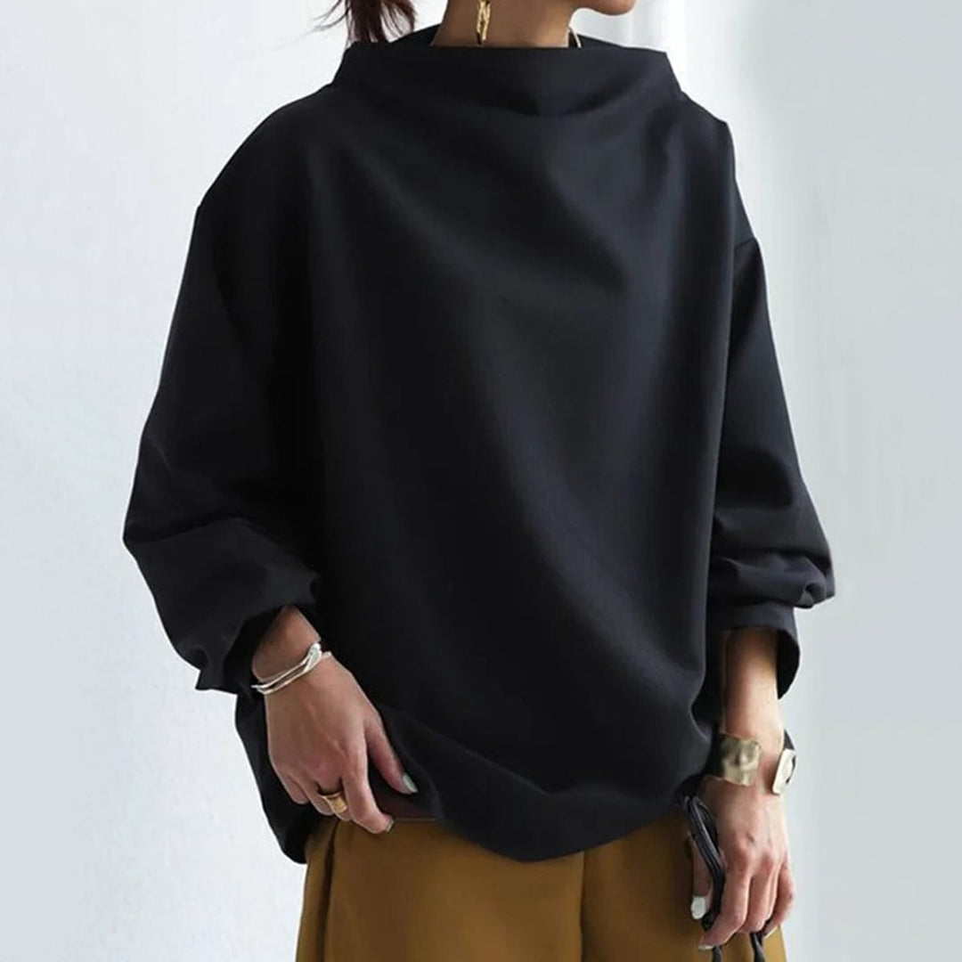 Model wearing the Margot knit top in white paired with casual denim