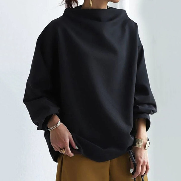 Model wearing the Margot knit top in white paired with casual denim