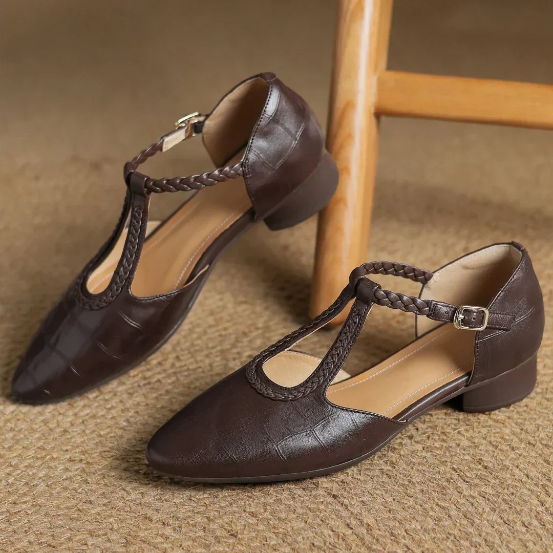 Margot leather mary jane flats in brown worn on feet, styled with tailored trousers