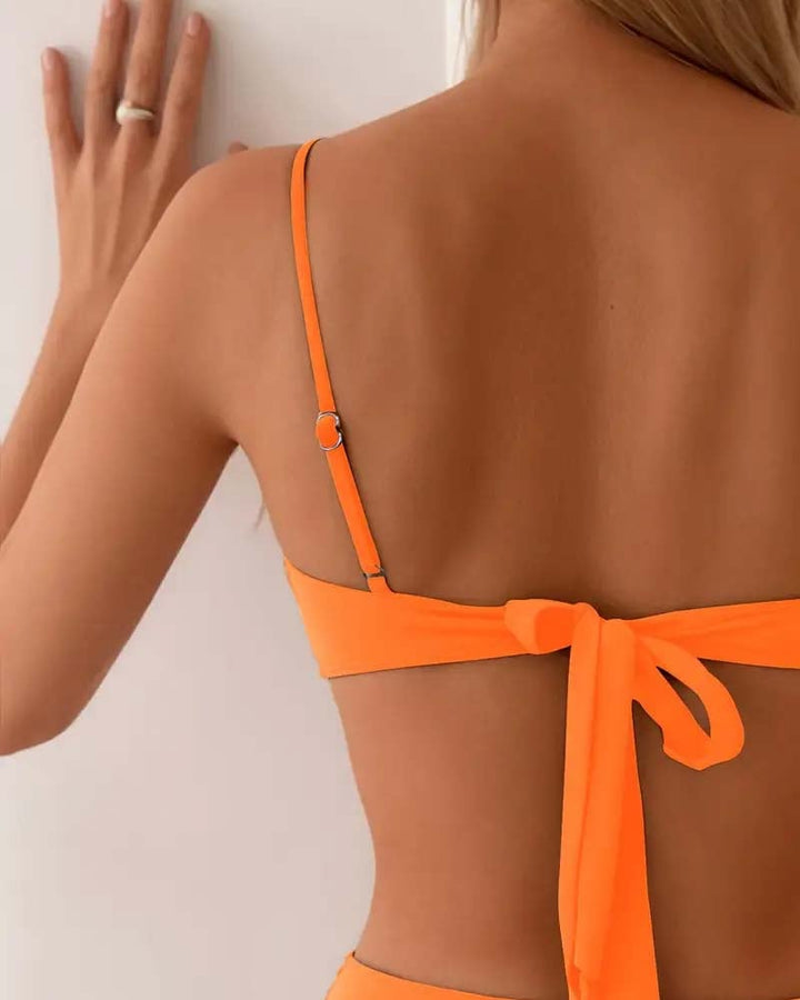 Side profile of the Marguerite bikini set in brown highlighting the sleek lines