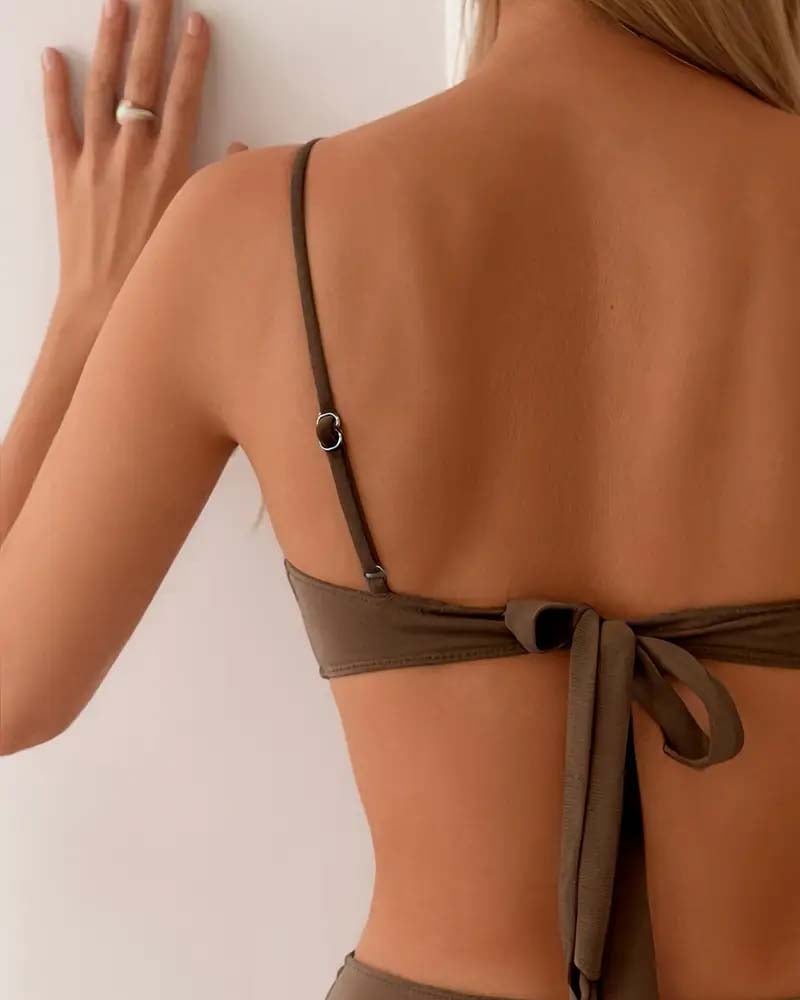 Close-up of the Marguerite bikini top in brown showing refined detailing