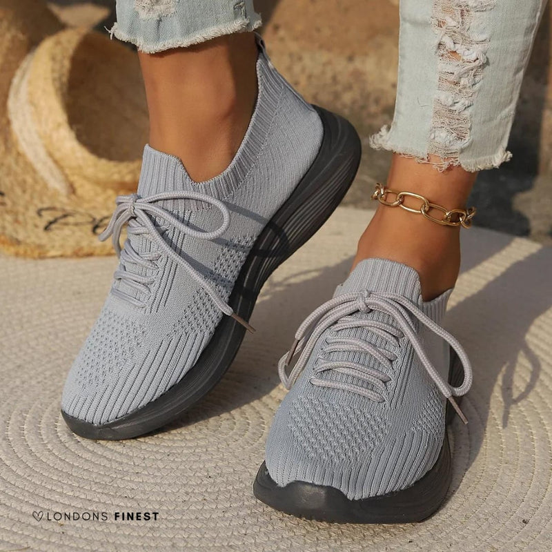 Marguerite women's orthopedic sneakers in gray showing ergonomic sole and sleek low-profile silhouette, front angle view