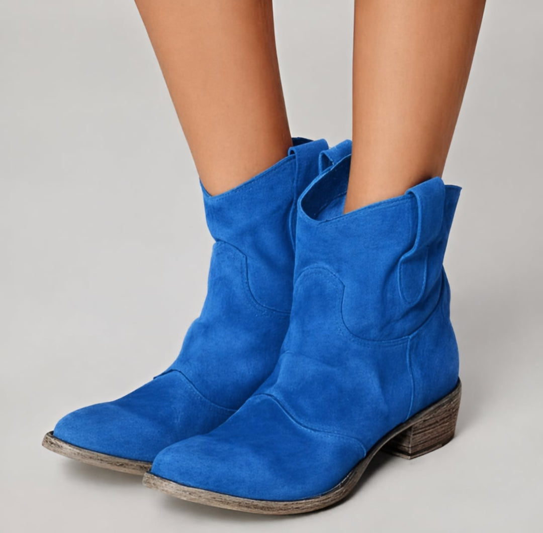 Women's suede ankle boots in blue displayed on a clean white background