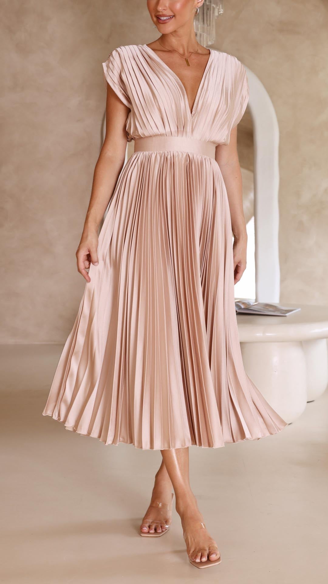 Front view of champagne pleated maxi dress on model showing V-neckline and high-waisted silhouette