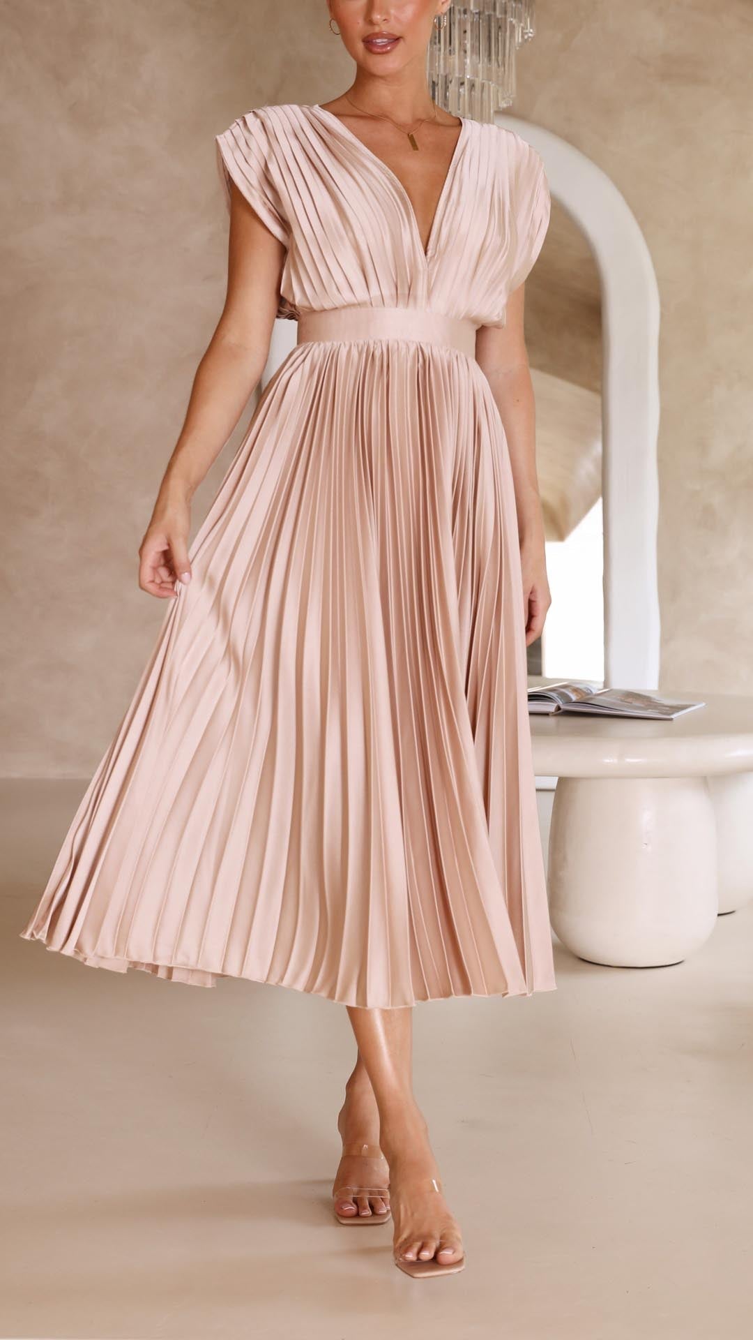 Close-up of champagne pleated maxi dress fabric and pleat detailing