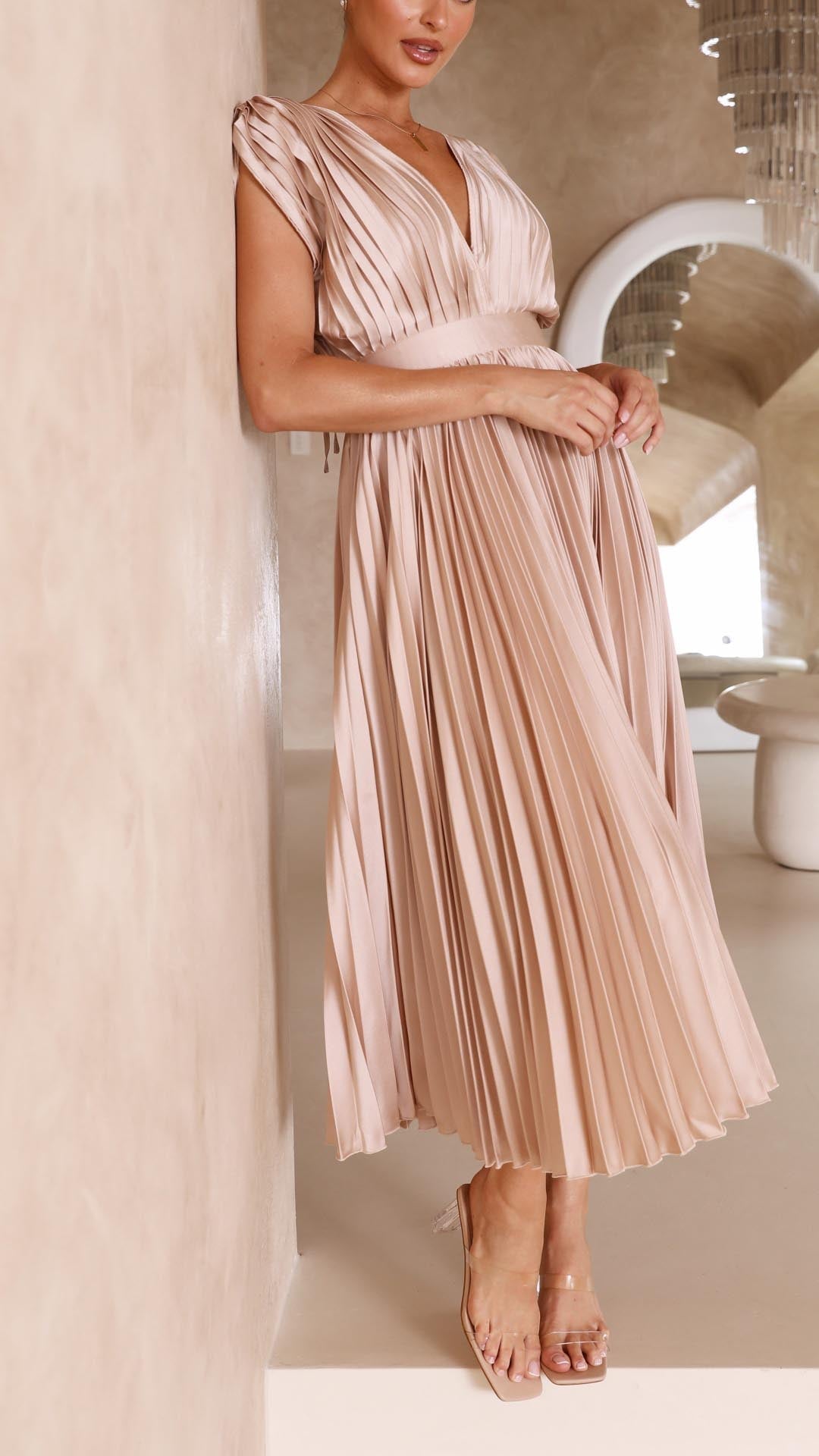Back view of model in champagne elegant pleated maxi dress
