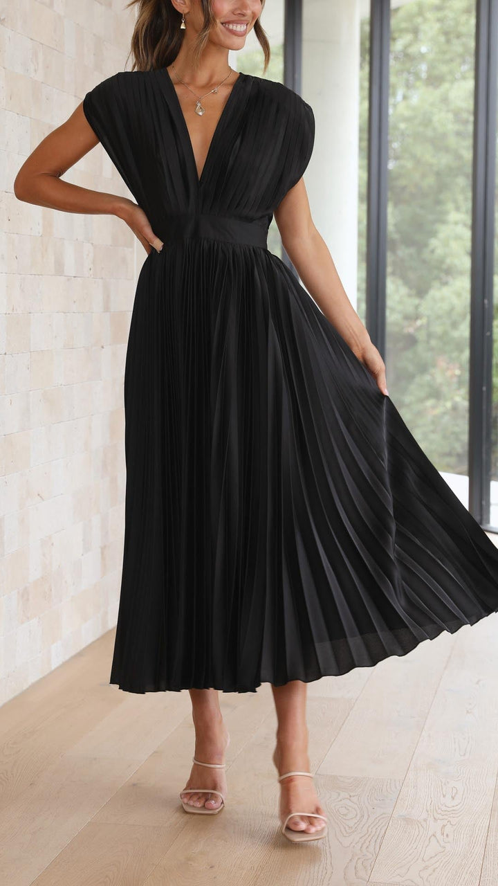 Back view of model in black elegant pleated maxi dress