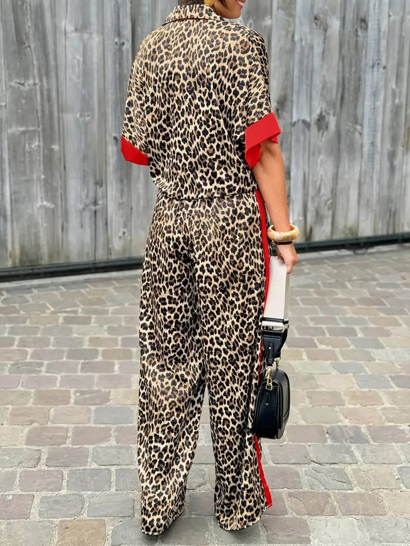 Close-up of the leopard print fabric detail and color accents on the wide-leg pants