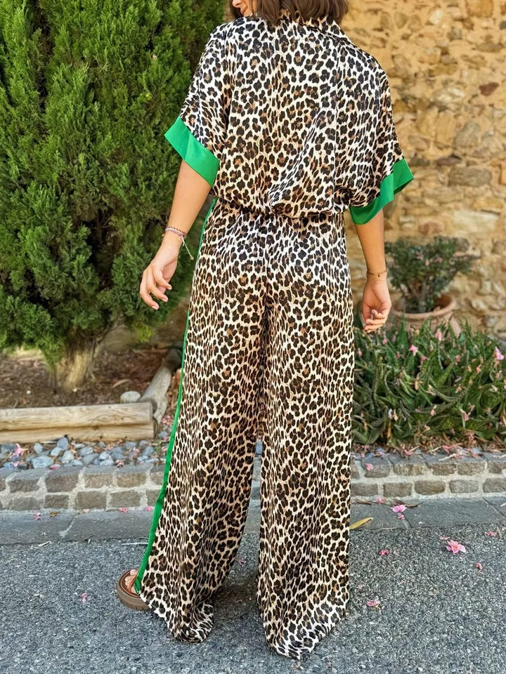 Side view of the fluid leopard print wide-leg set highlighting the flowing pant leg and loose top