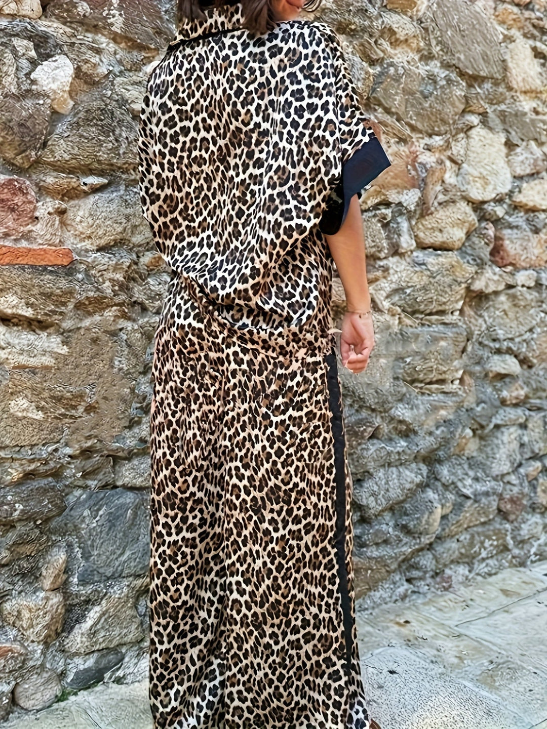 Flat lay of the leopard print two-piece set in all three colorways: red, green, and black