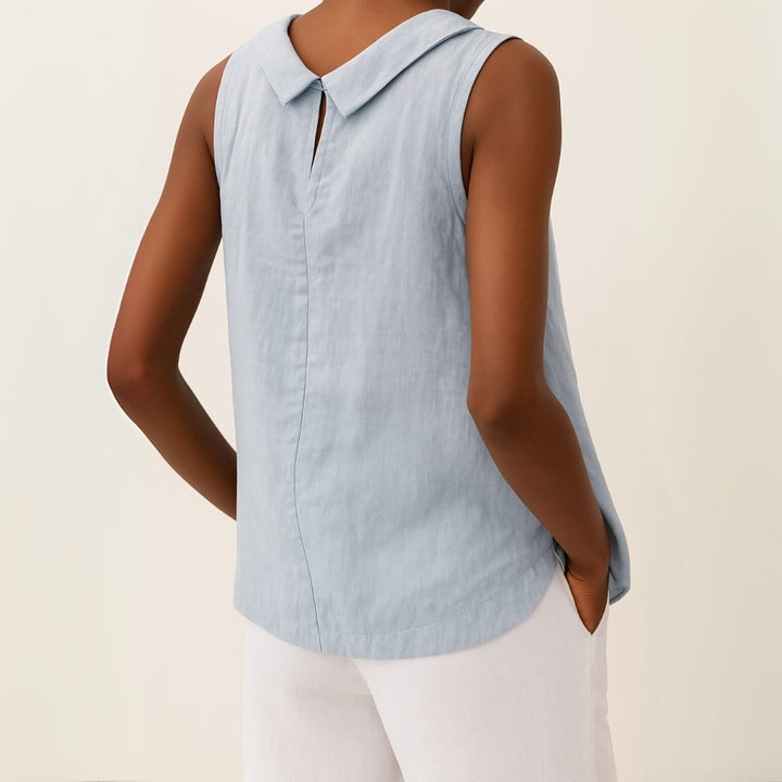 Sleeveless roll collar top styled with wide-leg trousers for a polished everyday outfit