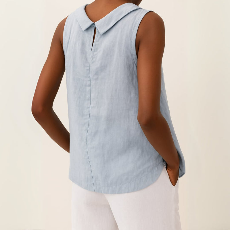 Sleeveless roll collar top styled with wide-leg trousers for a polished everyday outfit