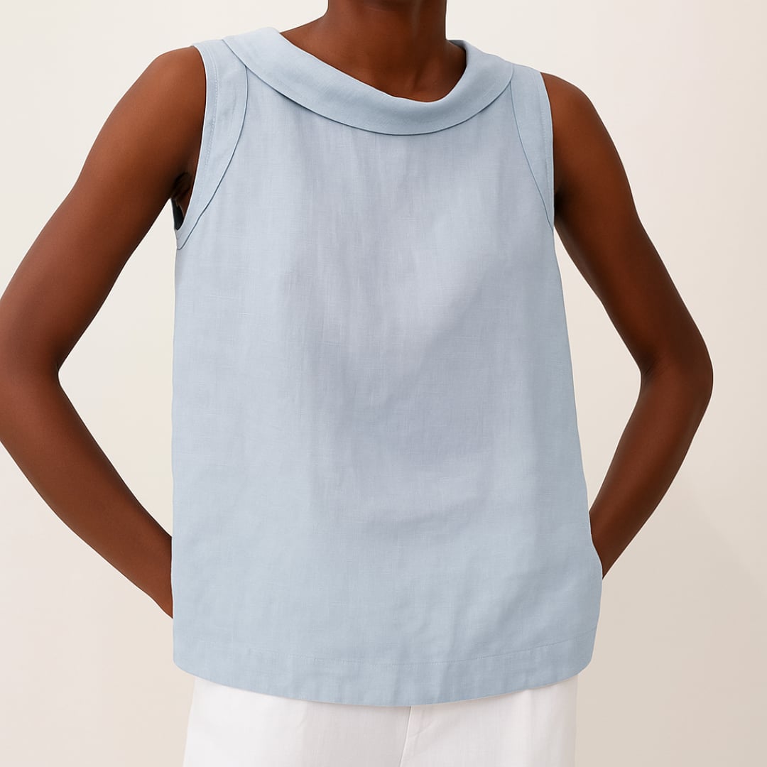 Side profile of a woman wearing the sleeveless roll collar top, highlighting its draped silhouette