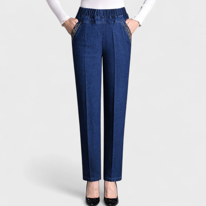 Woman wearing black stretch jeans with elastic waist, front view showing flattering fit