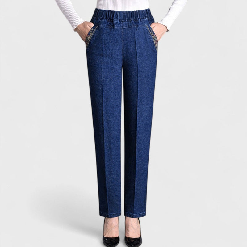 Woman wearing black stretch jeans with elastic waist, front view showing flattering fit