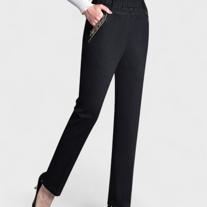 Side view of women's dark blue stretch jeans highlighting pocket placement and silhouette