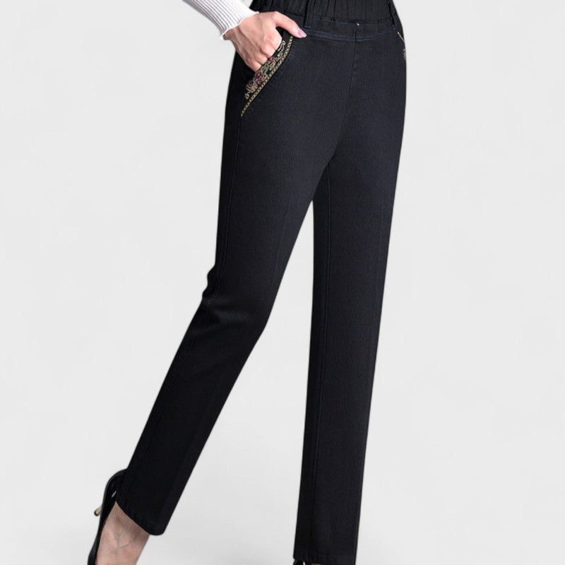 Side view of women's dark blue stretch jeans highlighting pocket placement and silhouette
