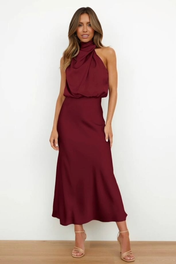 Overhead flat lay of the turquoise satin halter evening dress showing the full silhouette