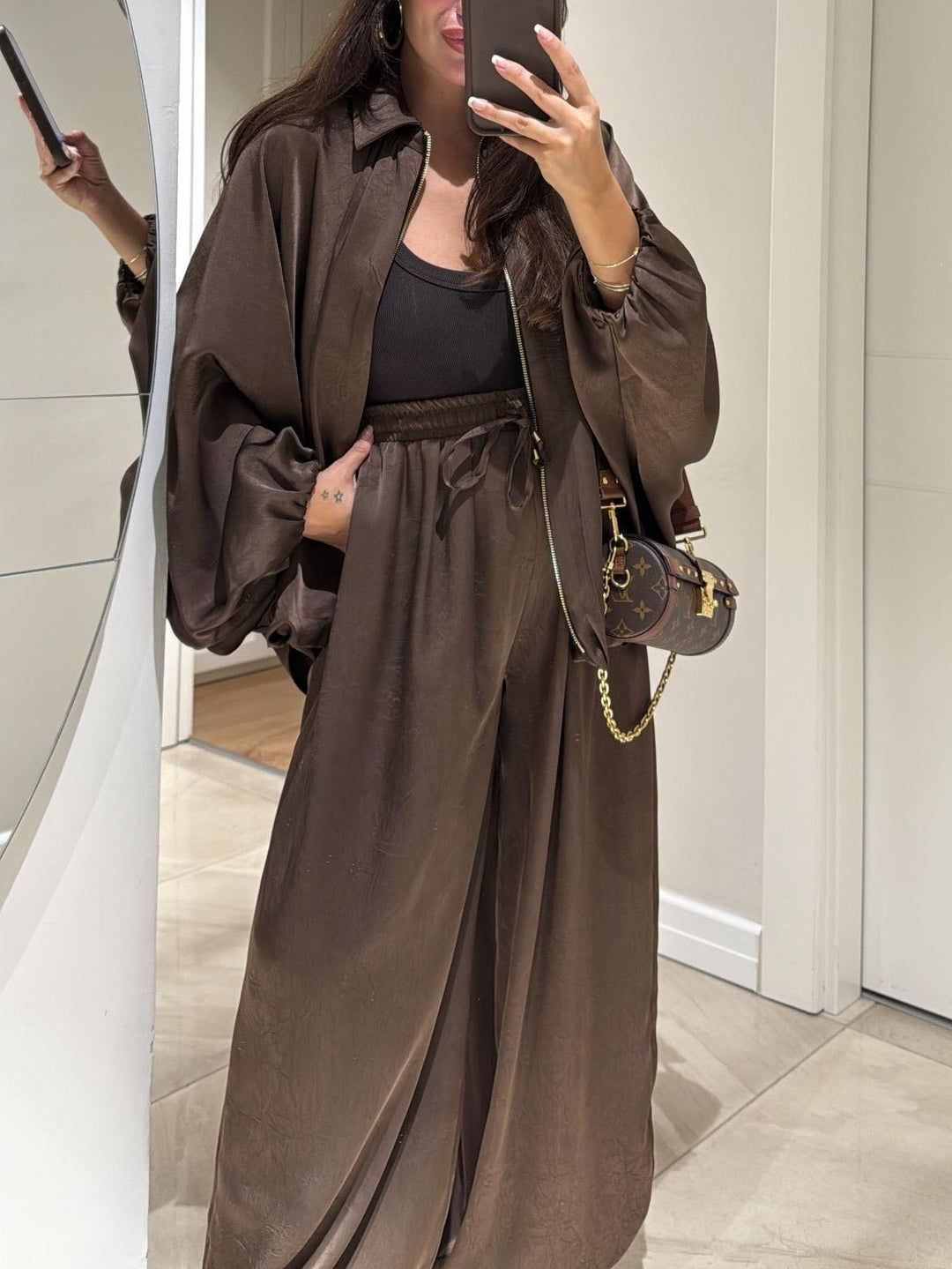 Flat lay of brown Maribel jacket and drawstring pants set