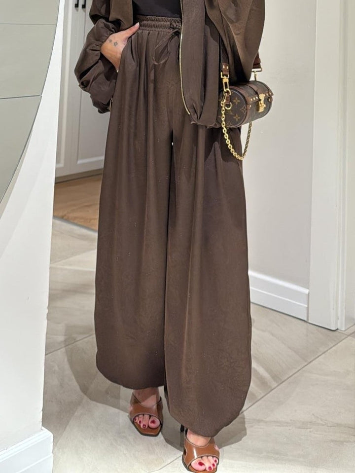 Flat lay of claret Maribel jacket and drawstring pants set
